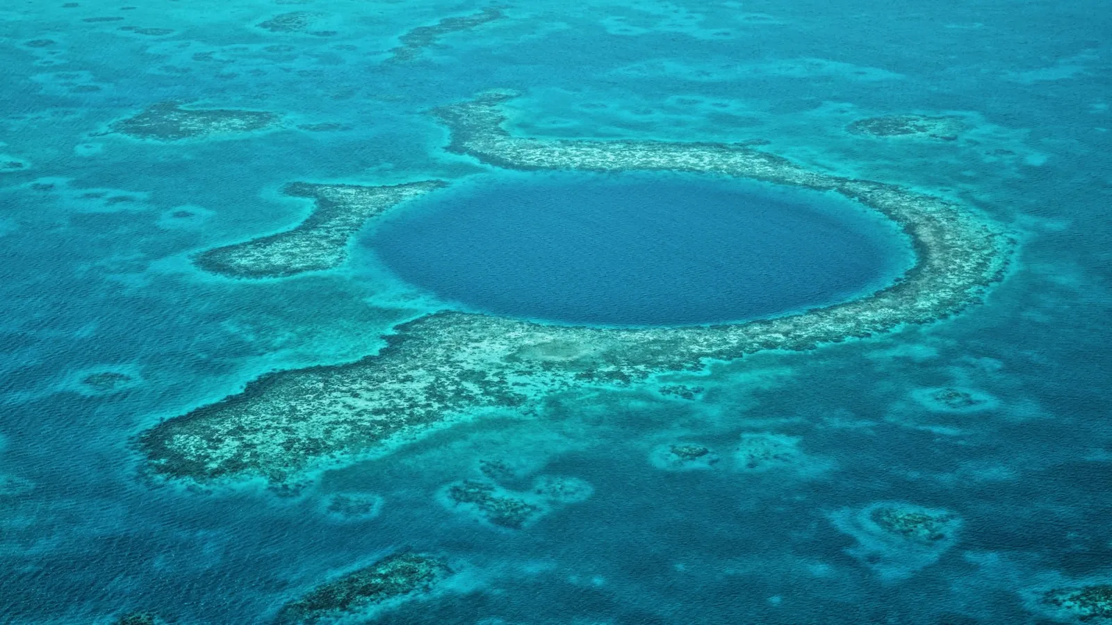 A large blue hole in the middle of the ocean