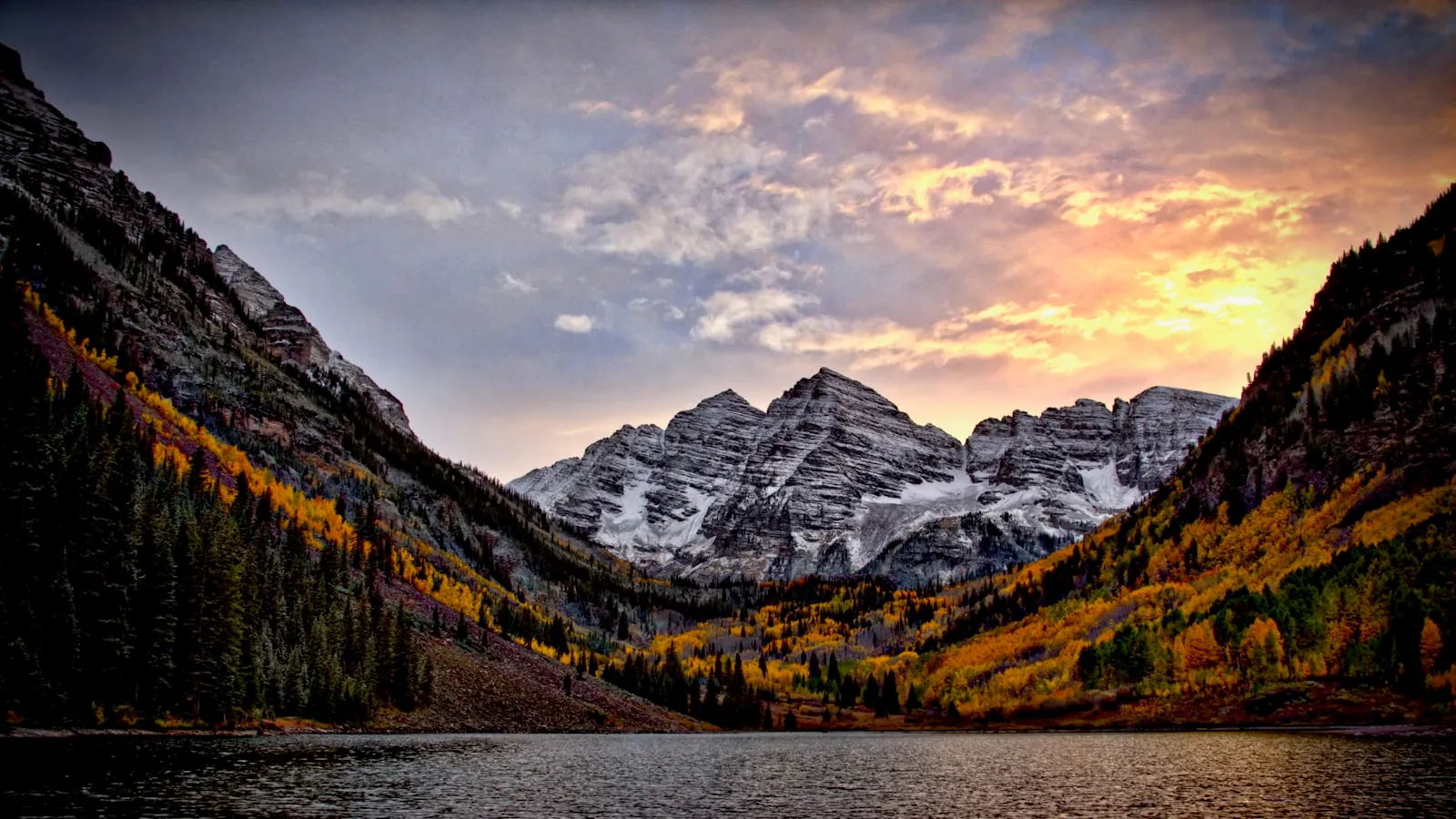 Body of water across the mountain during sunset