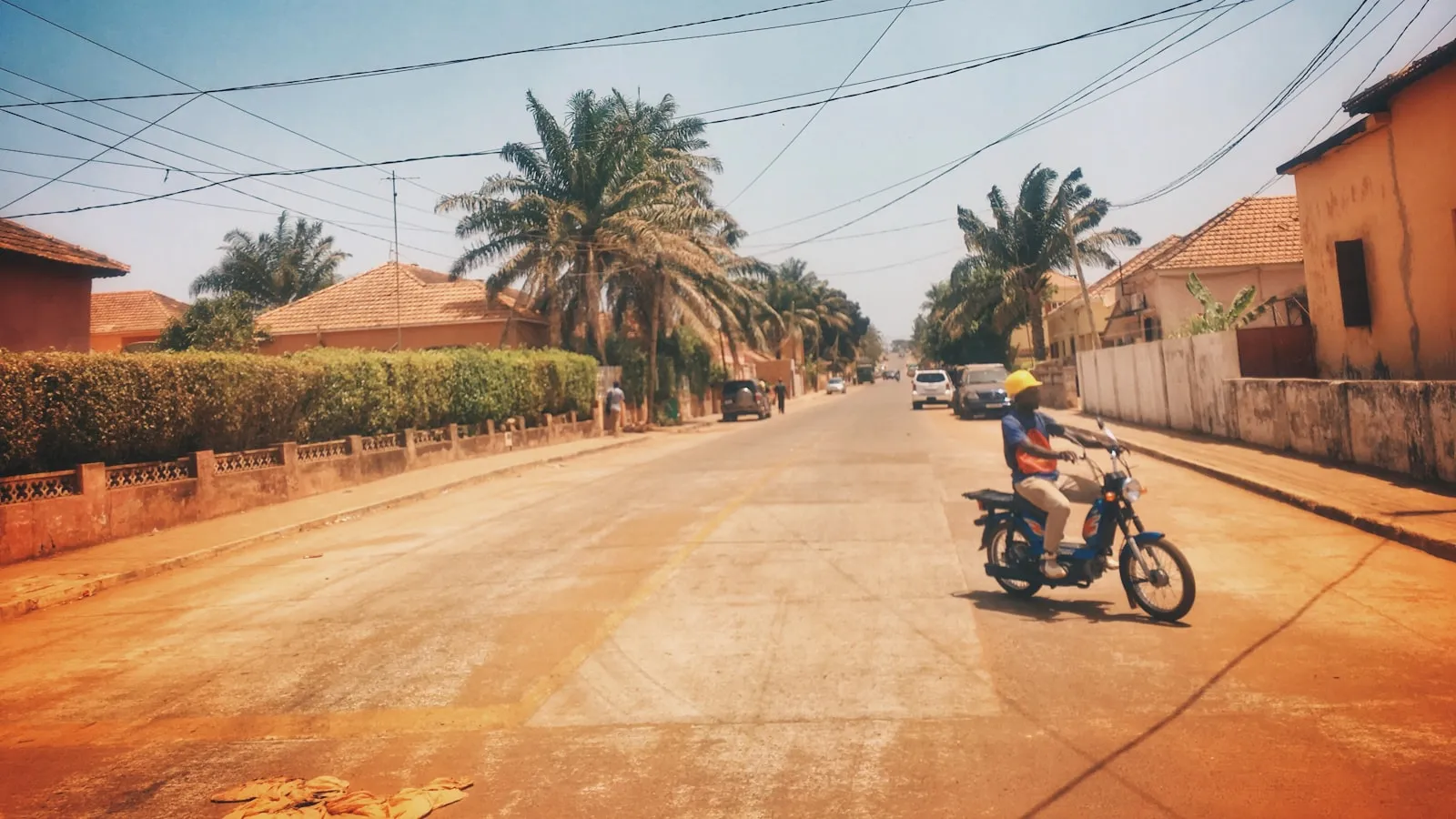 Man riding motorcycle on road during daytime