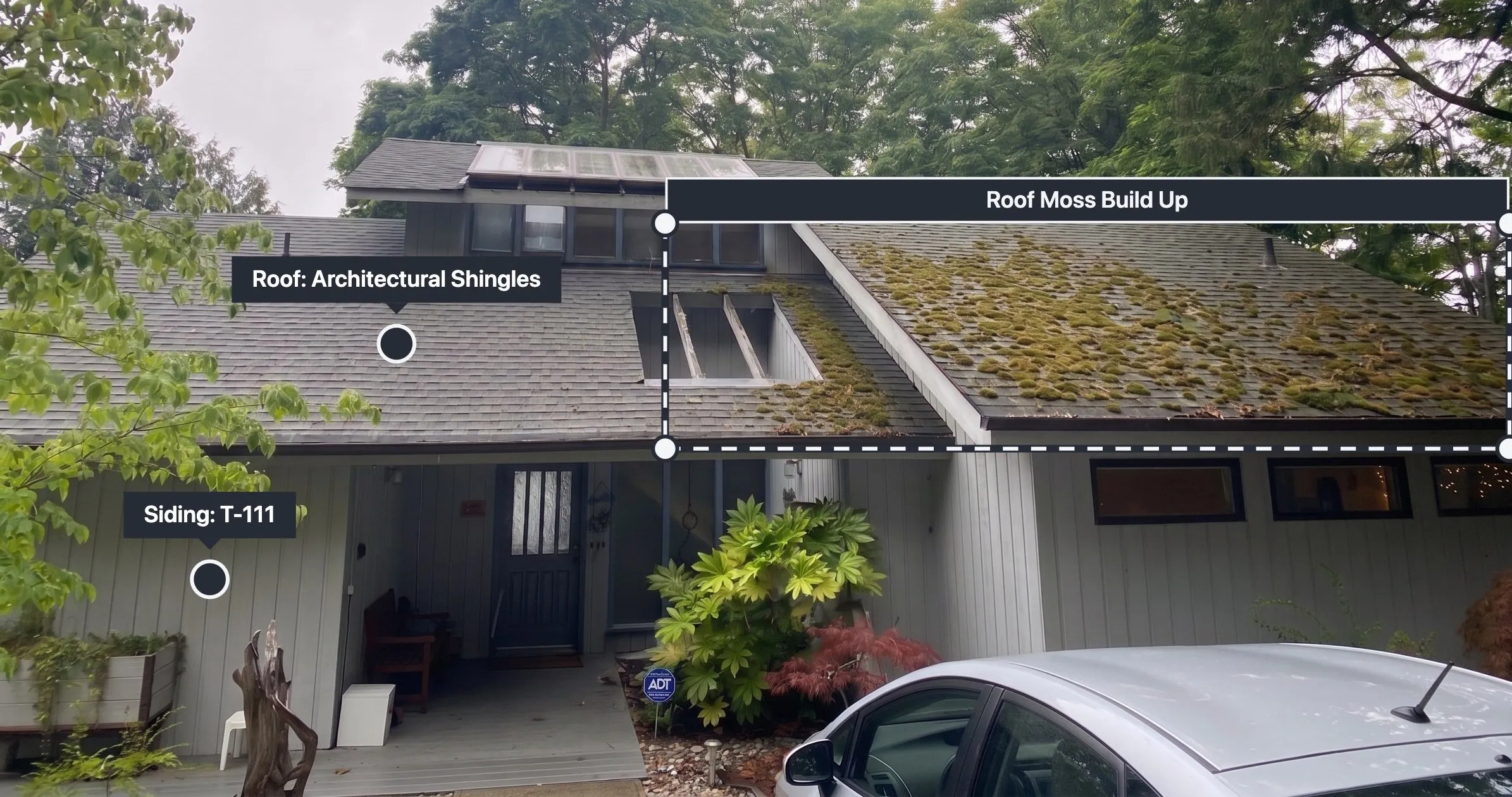 An exterior inspection photo of a house annotated by Yembo AI, flagging roof moss build up and labeling the roof as architectural shingles and the siding as T-111.