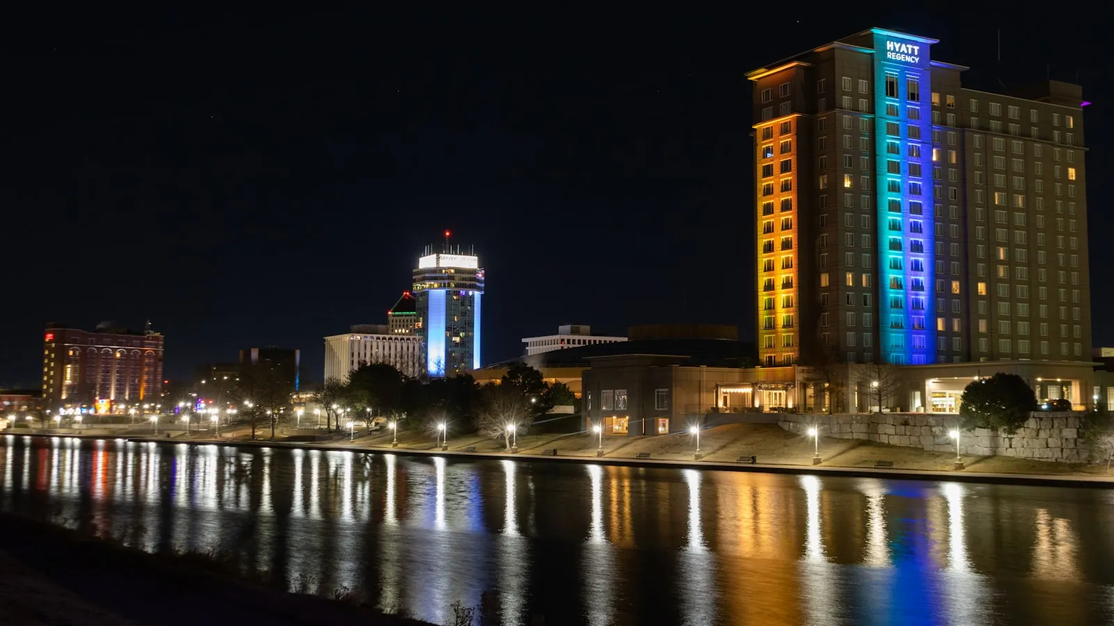 A night view of a city with a river running through it