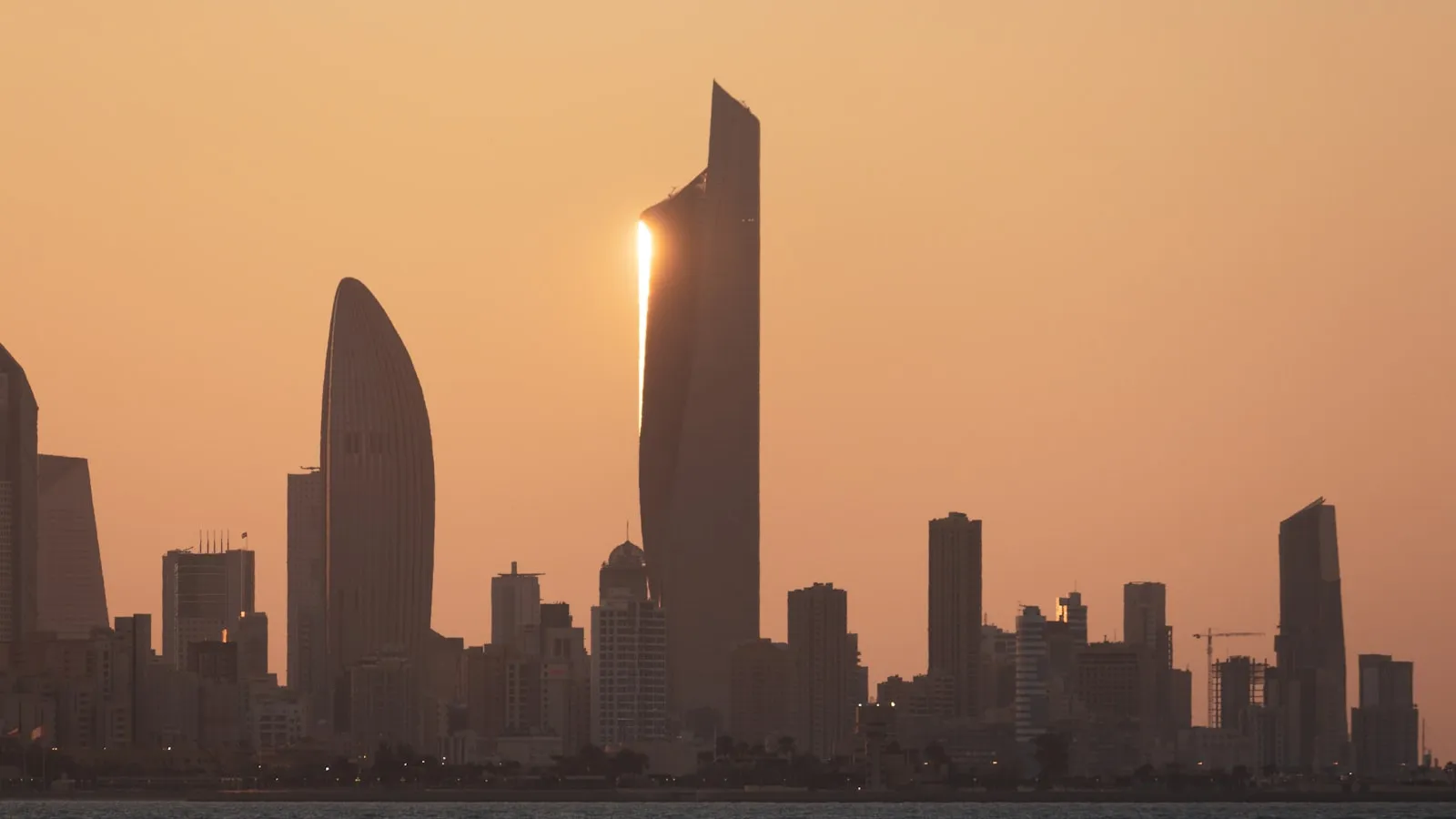 City skyline during sunset with city skyline in the distance