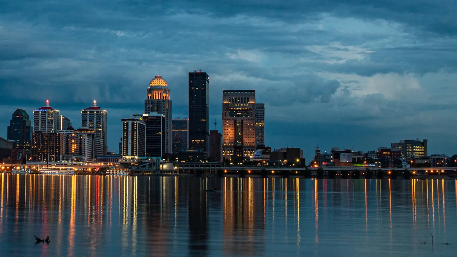 City skyline at dusk with water reflections
