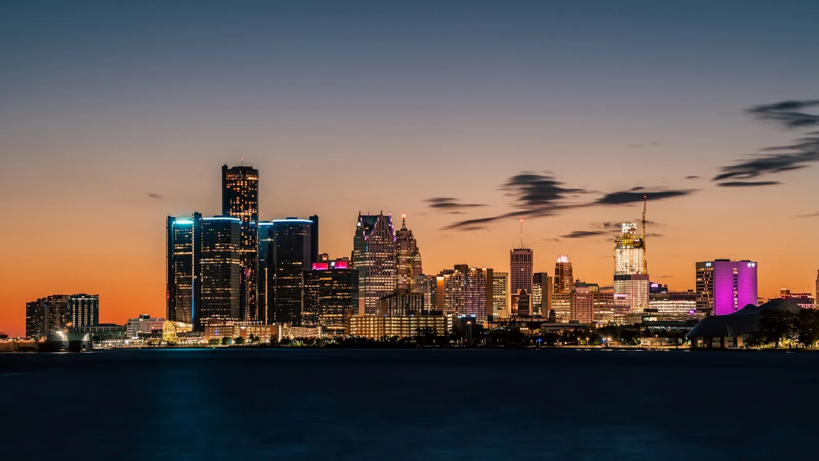 A view of a city at night from across the water