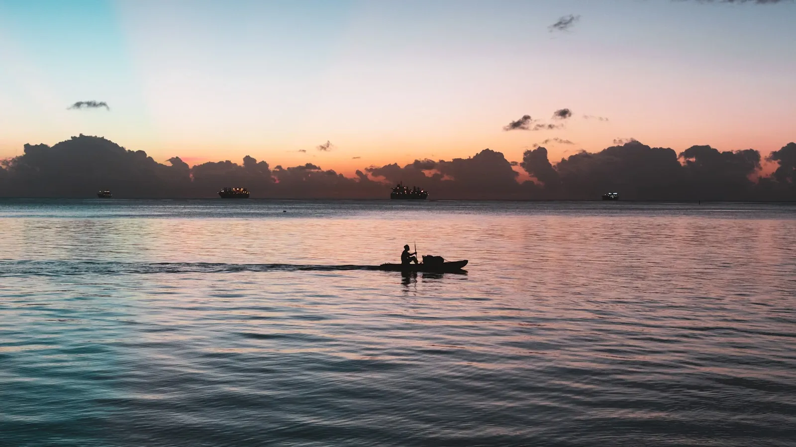 Silhouette photo of person on boat