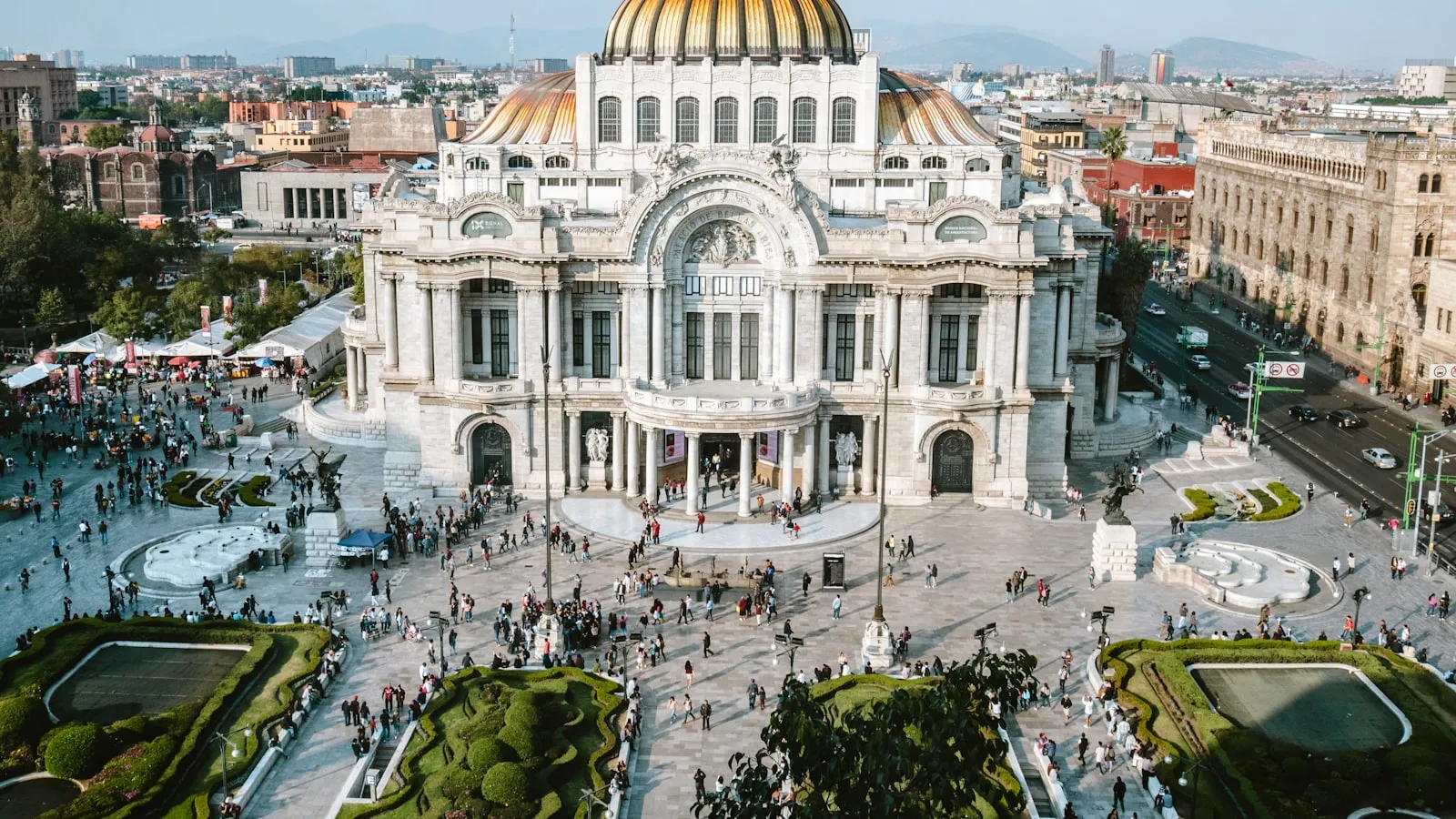 Aerial photo of people walking near white concrete dome building during daytime