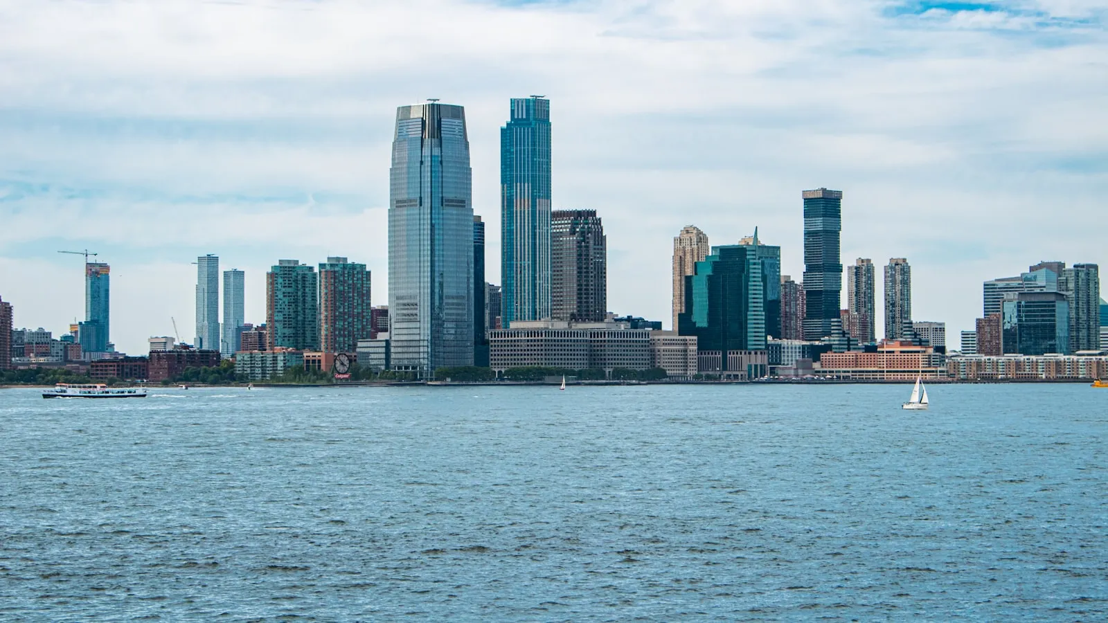 A large body of water with a city in the background