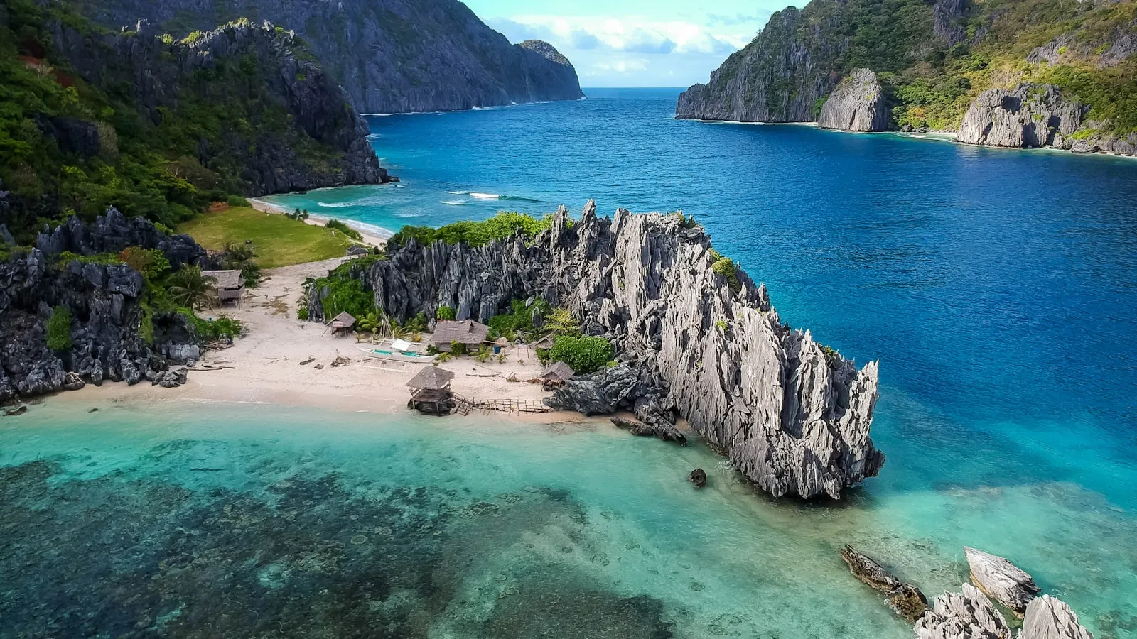 Aerial photo of body of water between mountains