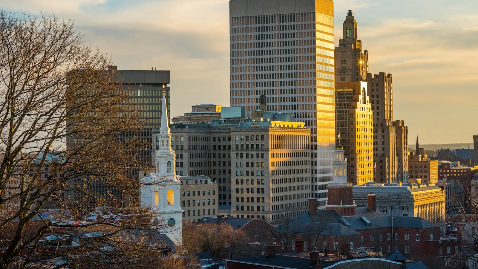 A city skyline with tall buildings and a clock tower