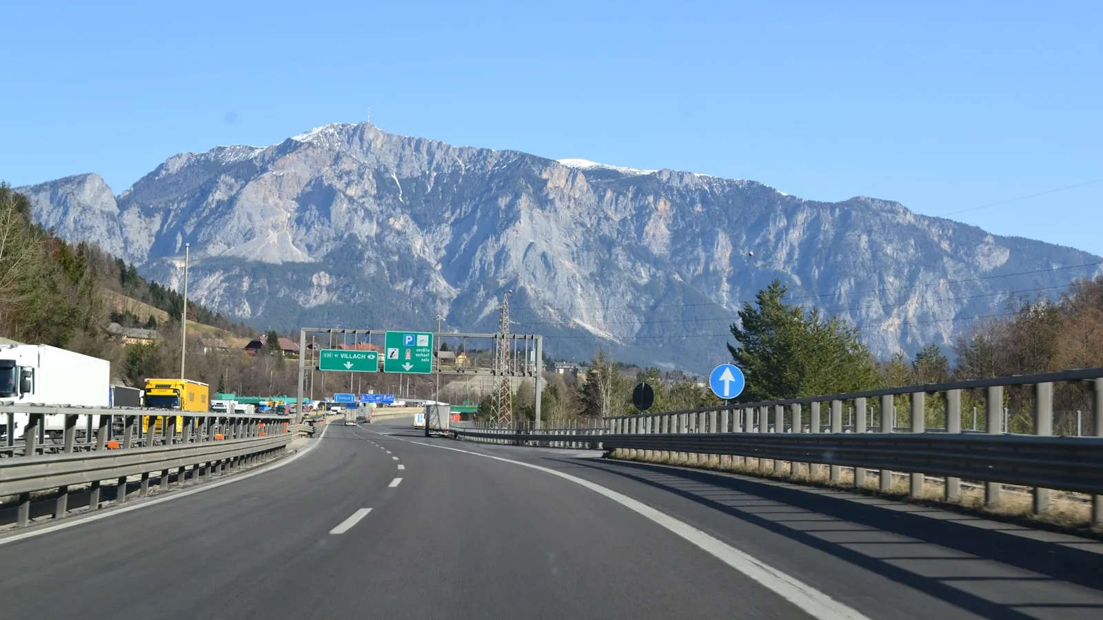 Highway leading towards a majestic mountain range