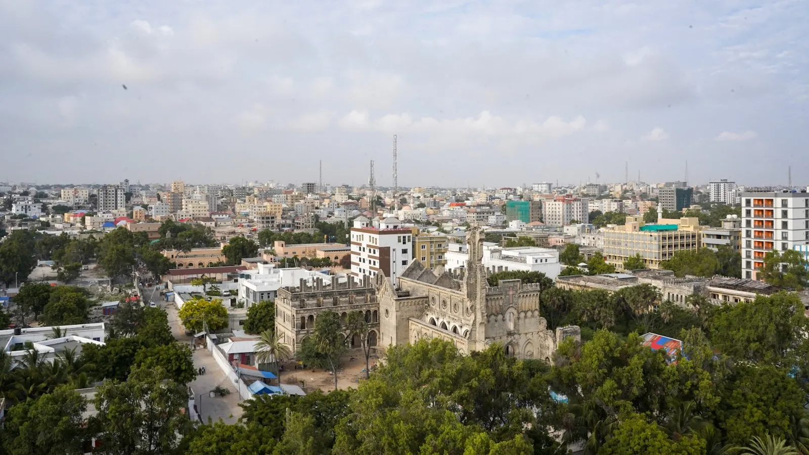 Cityscape with historic building and lush trees