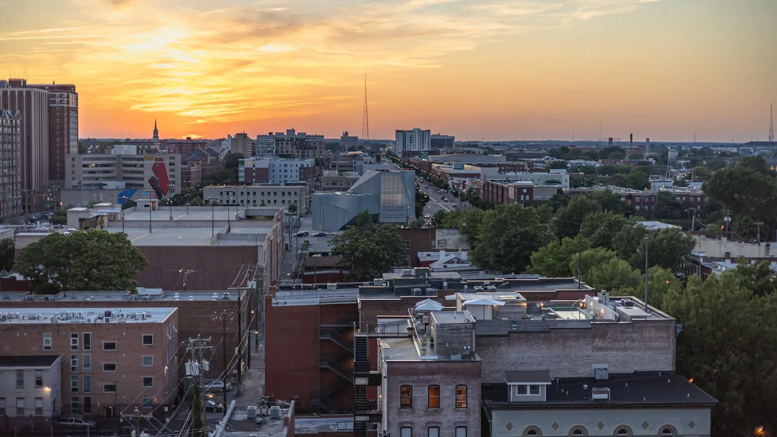 A view of a city at sunset from a tall building