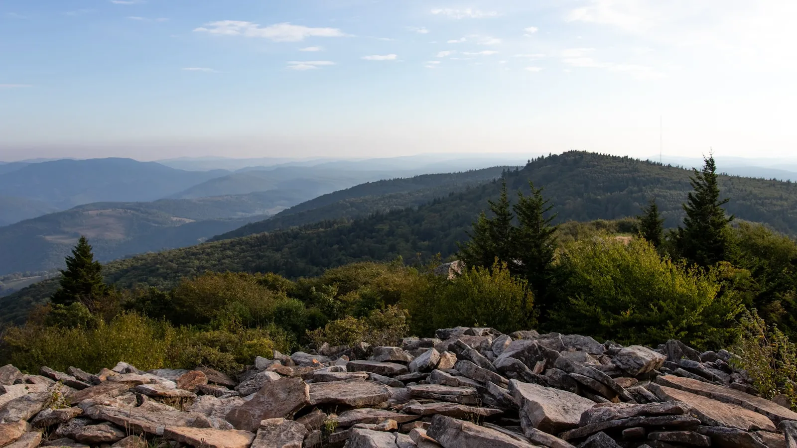 A view of a mountain range with rocks and trees